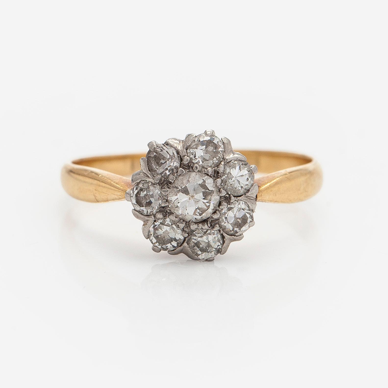 An 18K gold ring with old-cut diamonds.