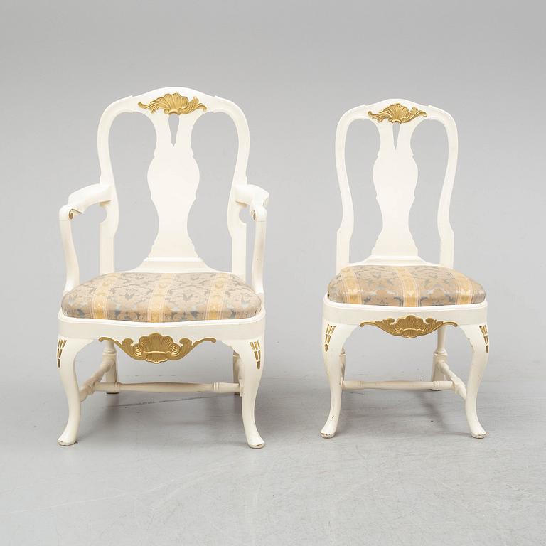 A dining table and six chairs, rococo style, mid 20th century.