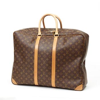 595. A 1998s monogram canvas travelling bag "Sirius" by Louis Vuitton.