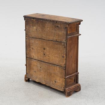 A Baroque style cabinet, circa 1900 with older parts.