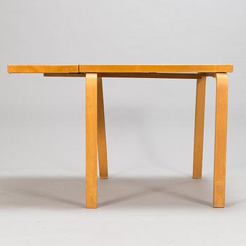 Alvar Aalto, a mid 20th century 'DL85' folding table, seven chairs for Artek.