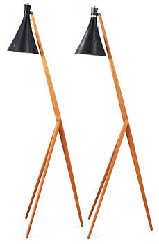 A pair of Uno and Östen Kristiansson teak tripod floor lamps with black shades. Luxus, Sweden 1950's.