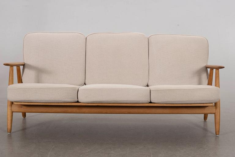 HANS J WEGNER, a Cigarren oka sofa Getama möbler Denmark later part of the 20th century.