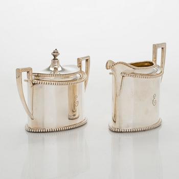 An early 20th century 4- piece sterling silver empire coffee set, C.G. Hallbergs Guldsmeds AB, Stockholm.