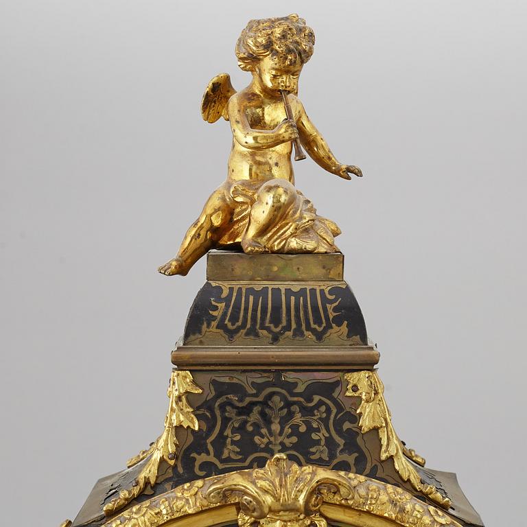 A boulle style table clock, circa 1900.