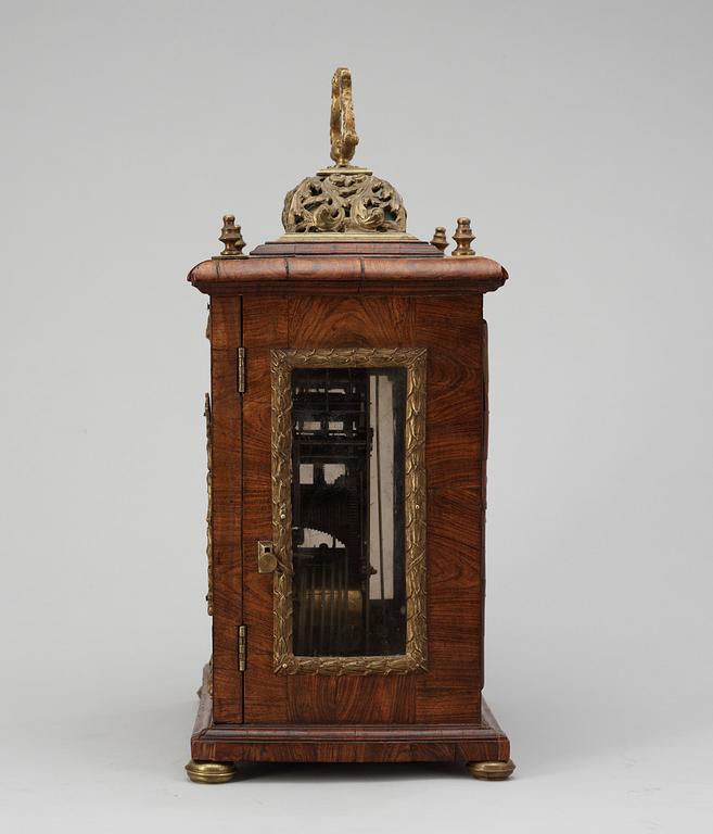 A Queen Anne early 18th century brass-mounted walnut striking table clock by Jacobeus Markwick.