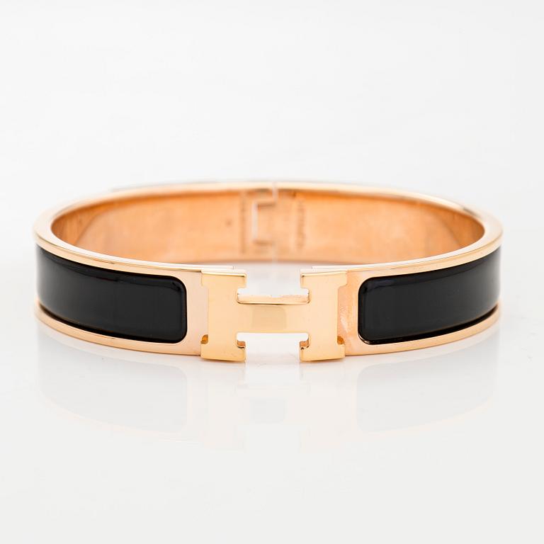 Hermès, a 'Clic H' bracelet.
