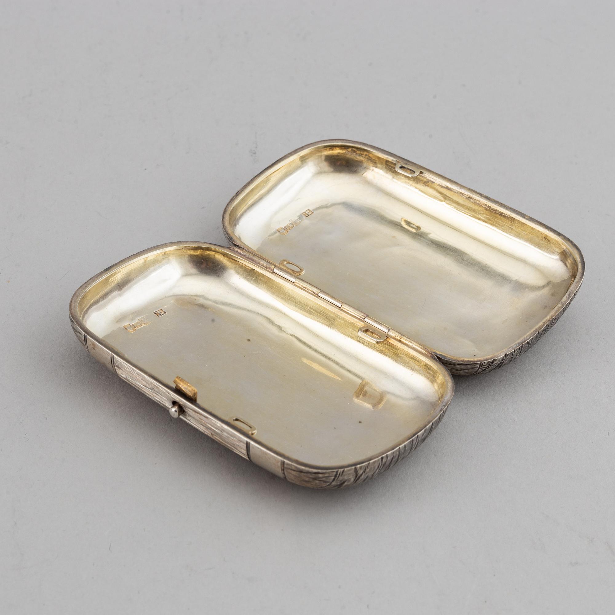 A Russian silver cigarette-case, marked EB, 1883.