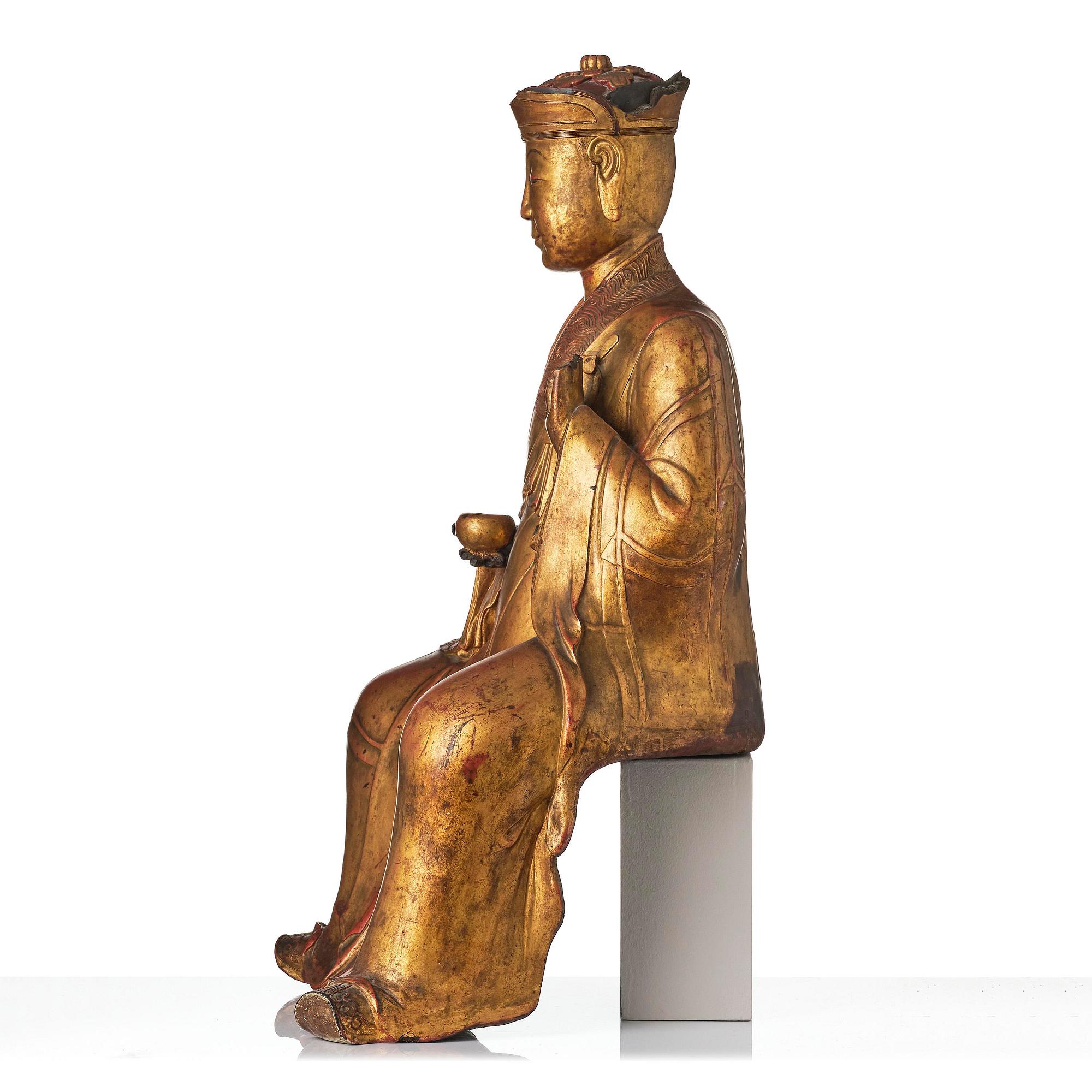 A large gilt lacquer figure of a deity, Vietnam, 19th century.