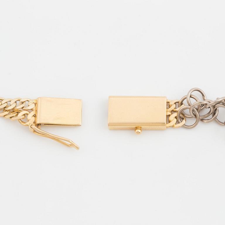 A two-rowed, flattened curb-link necklace.