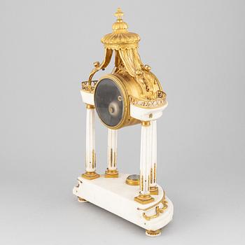 A Louis XVI marble and gilt bronze mantel clock, late 18th Century.