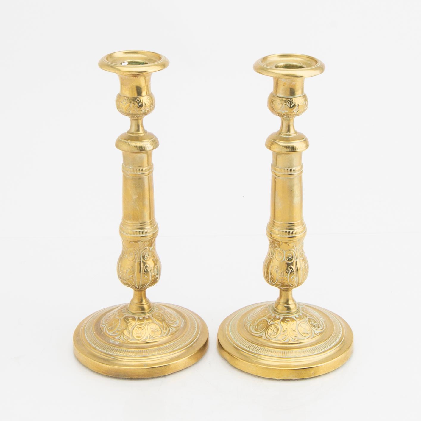 A pair of 19th century brass candle sticks.