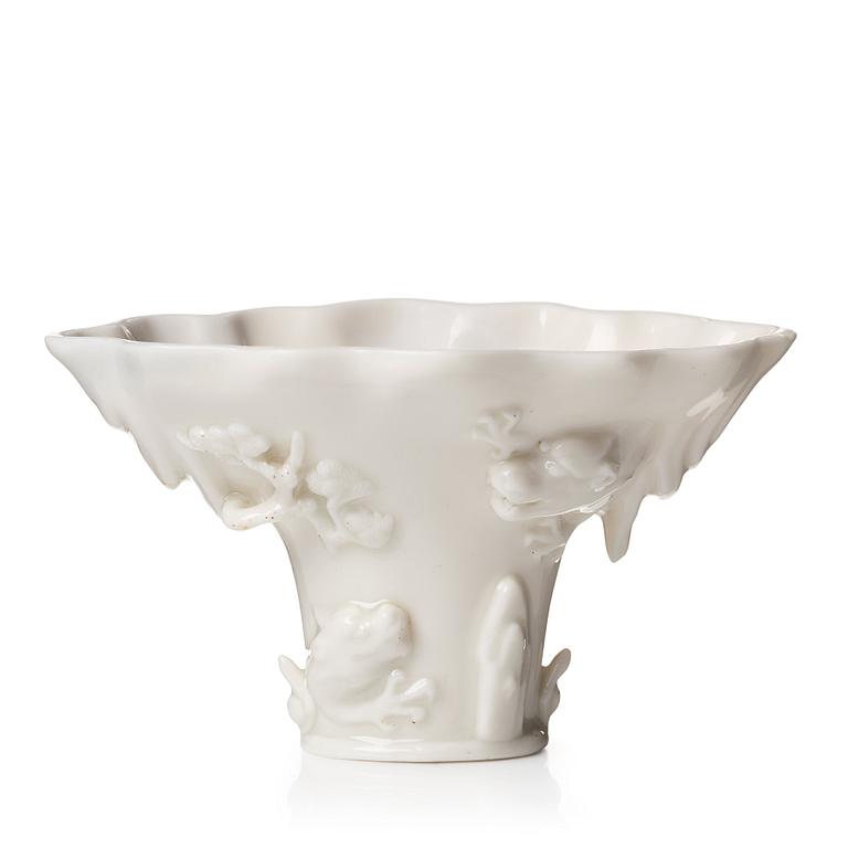 A blanc de chine rhinoserous libation cup, Qing dynasty, Kangxi (1662-1722).