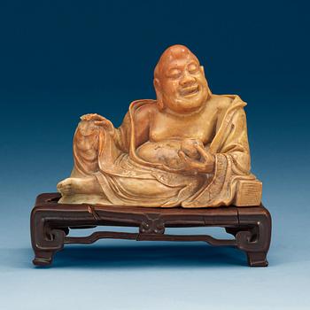 A stone figure of Budai, presumably late Qing dynasty (1644-1912).