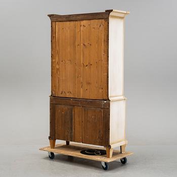 A gustavian style cabinet, circa 1900.
