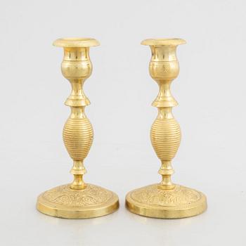 A pair of brass candlesticks, first half of the 19th Century.