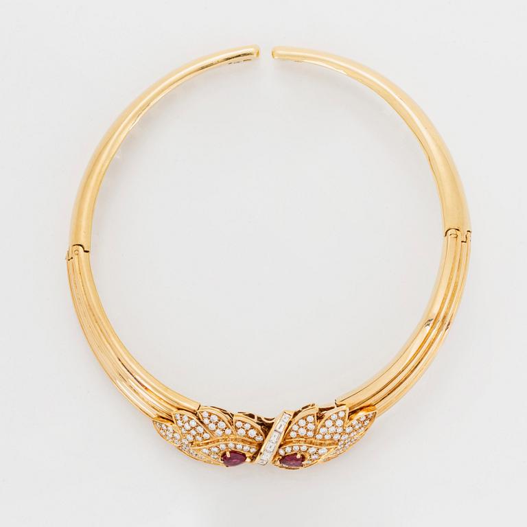 A necklace and a braclet in 18K gold set with faceted rubies.