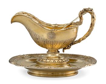 254. A SAUCE-BOAT WITH LADLE, 84 silver. Gilt. Nichols & Plincke, purveyer of the court, St. Petersburg 1859. Weight 1600 g.