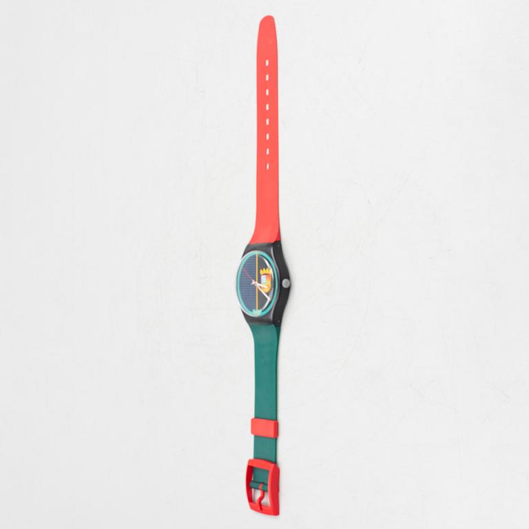 A wall clock, Swatch.