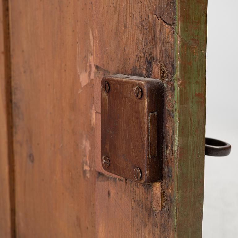A hanging cabinet, dated 1832.