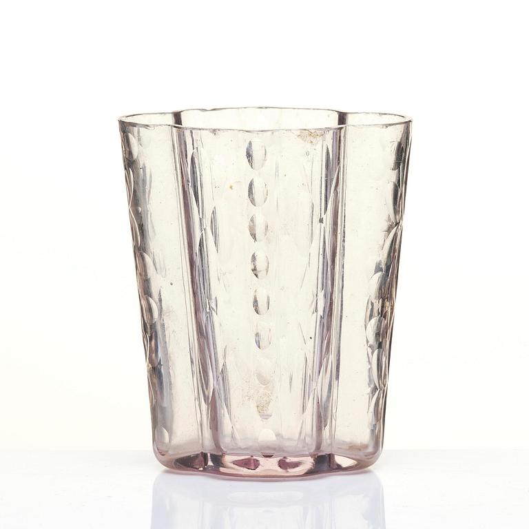 An amethyst coloured suger shaker and a cut glass goblet, 18th century.