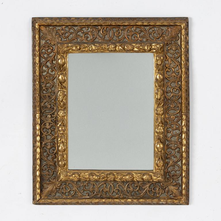 A Baroque style mirror, around the year 1900.