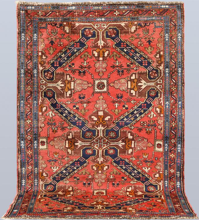 A Caucasian semi-antique rug, c. 200 x 128 cm.