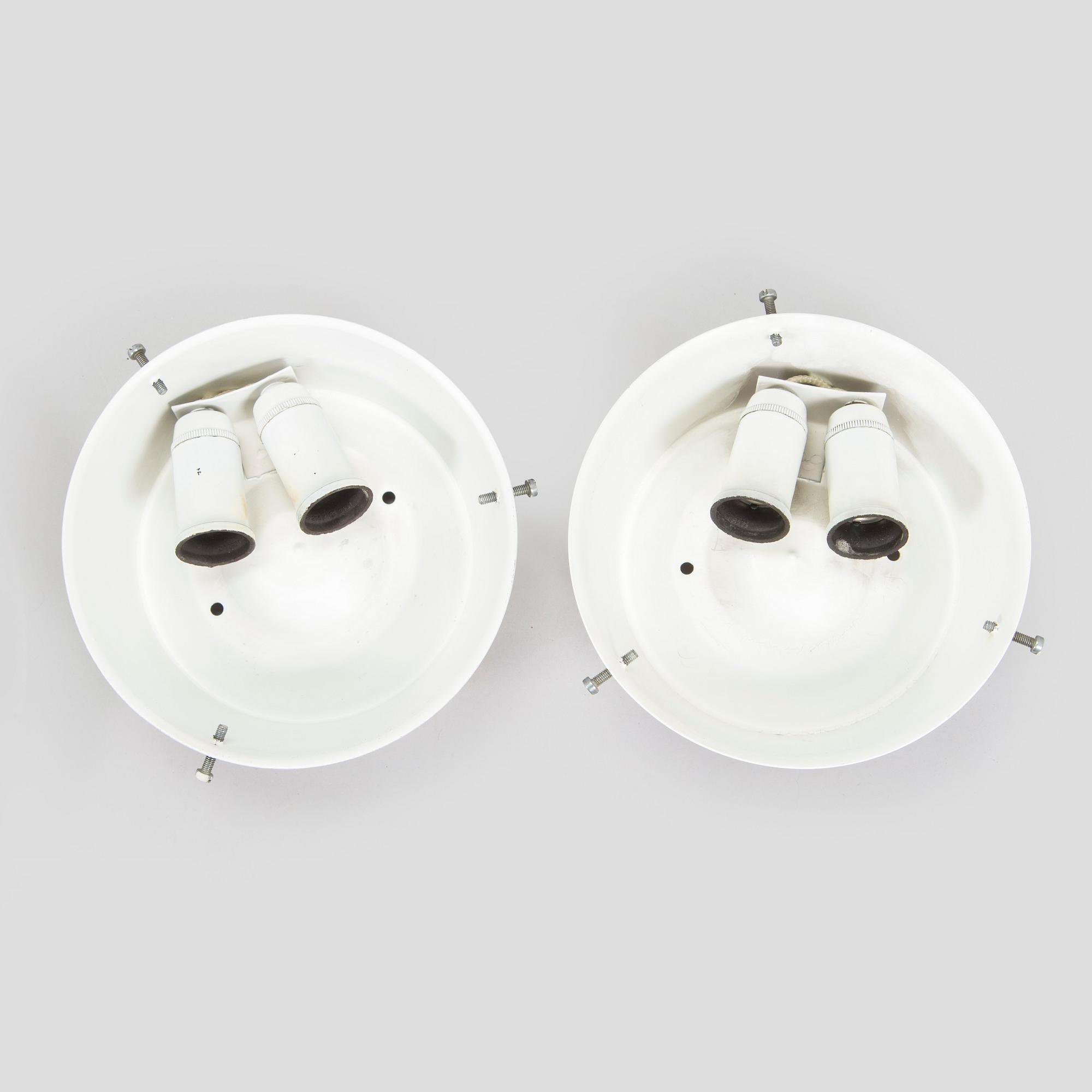 Arne Jacobsen, a pair of ceiling lamps/wall lamps, "AJ-Eklipta", Louis Poulsen, Denmark.