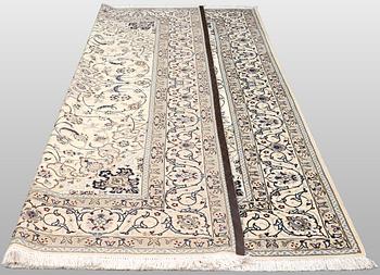 A Nain carpet, part silk, so-called 9 LAA, approx. 355 x 248 cm.