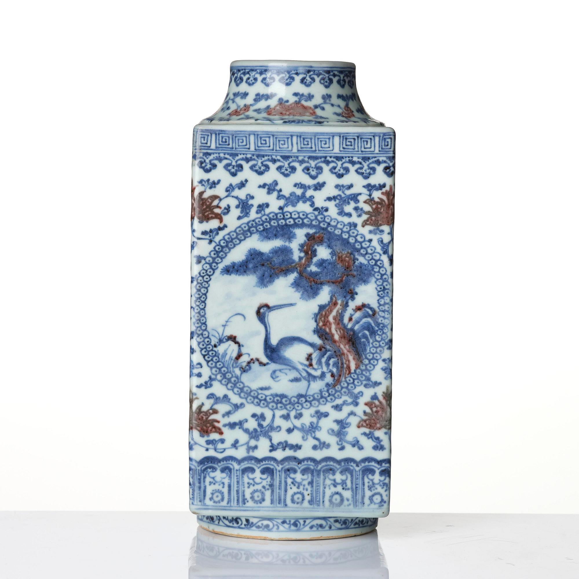 An underglaze blue and copper-red 'crane and deer' cong vase, Qing dynasty, 18/19th century.