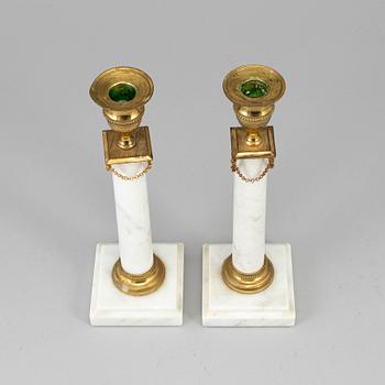 A pair of gustavian style candlesticks, early 20th century.