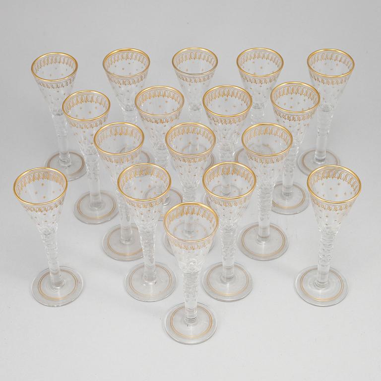 A set of 17 cut and gilded glasses, 20th Century.