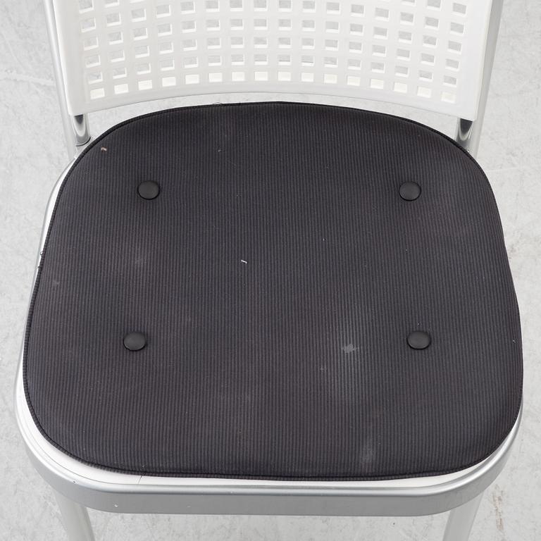 Vico Magistretti, a "Shine" dining table with twelve chairs, De Padova, Italy, around the year 2000.