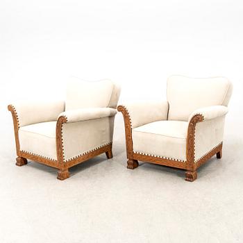 A pair of easy chairs from the first half of the 20th century.