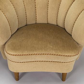 A pair of mid-20th century armchairs.