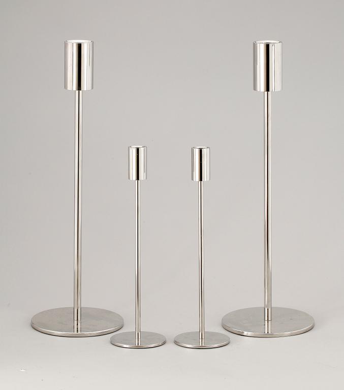 A set of four stainless steel candle sticks 'Noster', by Jonas Lindvall Skandiform.