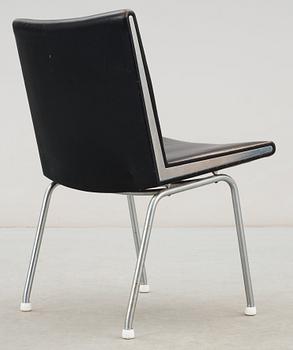 A Hans J Wegner 'Kastrup' steel and black leather chair, AP-stolen, Denmark.