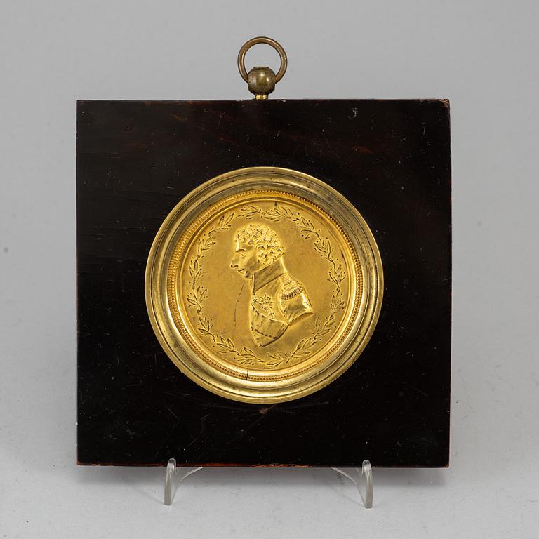 A gilt brass medalion, early 19th century.
