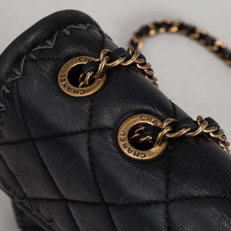 CHANEL, a black quilted fabric 'Flap Bag', 2015-2016.