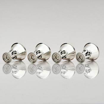 Evald Nielsen, four sterling silver beakers/cups on a foot, Denmark 20th century.