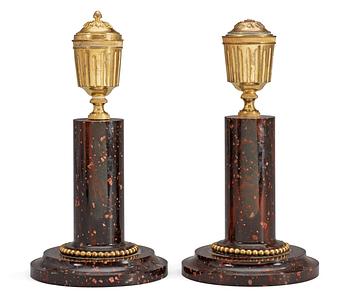 A pair of late Gustavian circa 1800 porphyry and gilt bronze candlesticks.