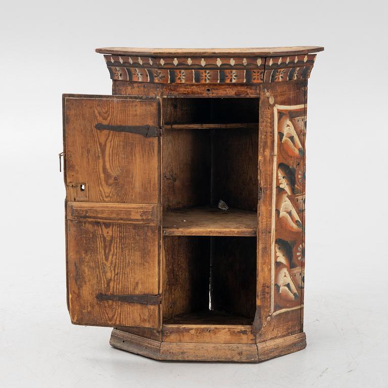 A Swedish traditional painted corner cabinet, Dalarna, 18th-/19th century.
