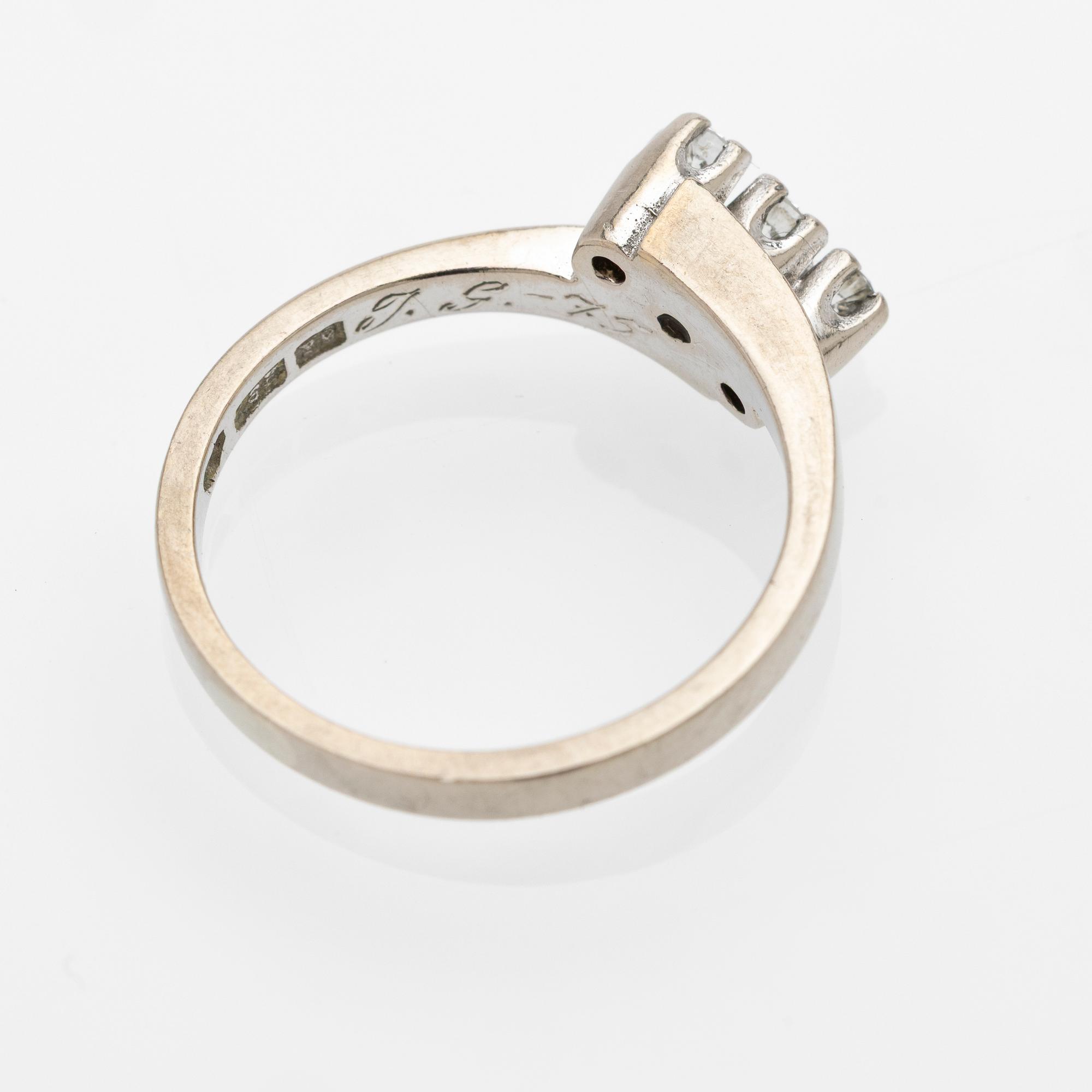 18K white gold ring with diamonds.