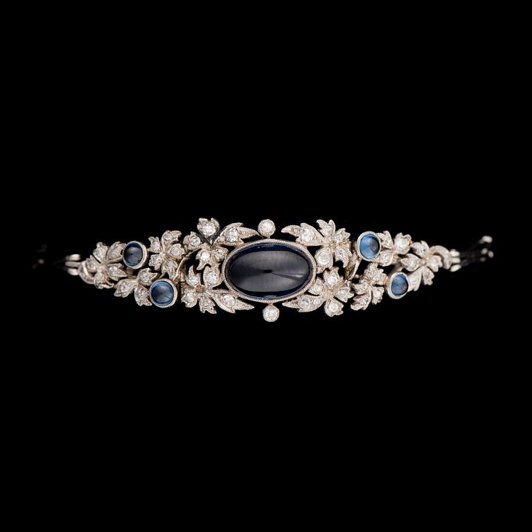 A BRACELET and A PAIR OF EARRINGS, cabochon cut sapphires, 8/8 cut diamonds, platinum. A. Tillander, 1950s.