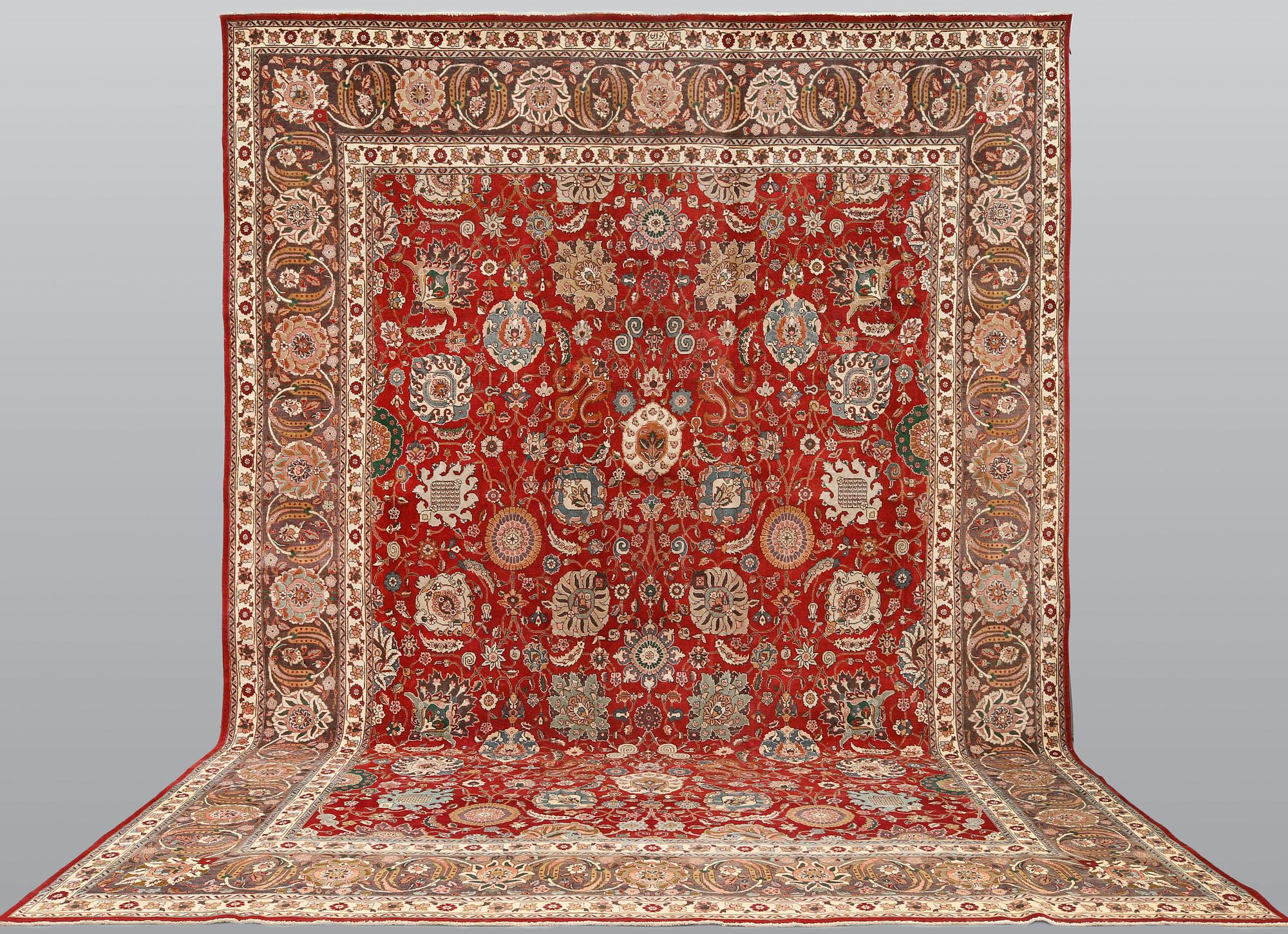 A Tabriz carpet signed Amirkhiz, ca 485 x 343 cm.