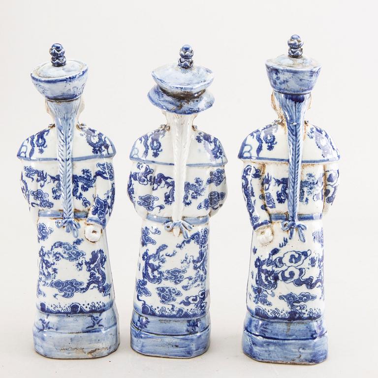 A set of three Chinese porcelain figurines.