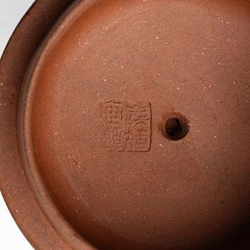 Two Chinese yixing teapots, early 1900s and 1980s.