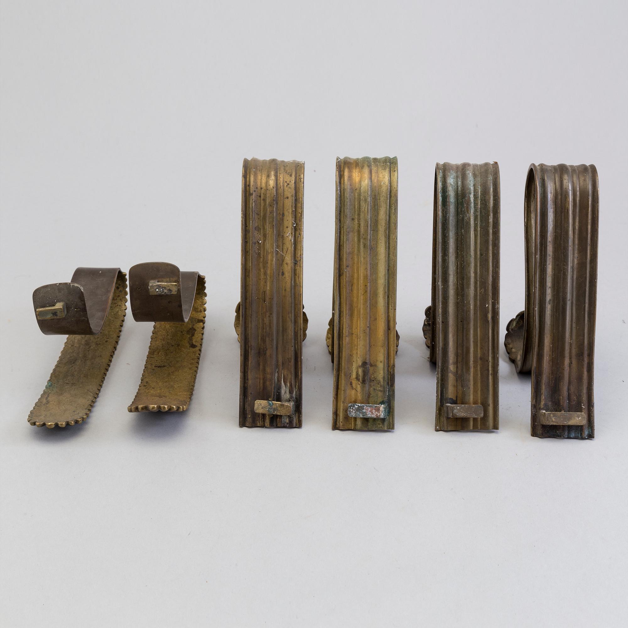 SIX BRONZE CURTAIN TIE-BACKS (4+2), 19th century.
