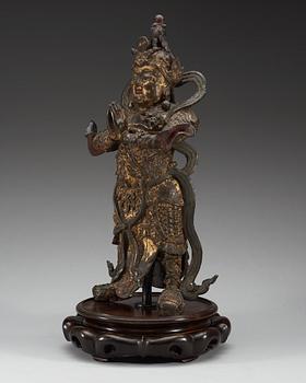A gilt bronze figure of a daoistic deity, late Ming dynasty, 17th Century.