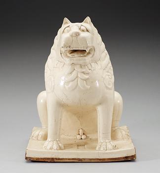A large white glazed figure of a 'Buddhistic Lion', Qing dynasty, presumably Kangxi (1662-1722).